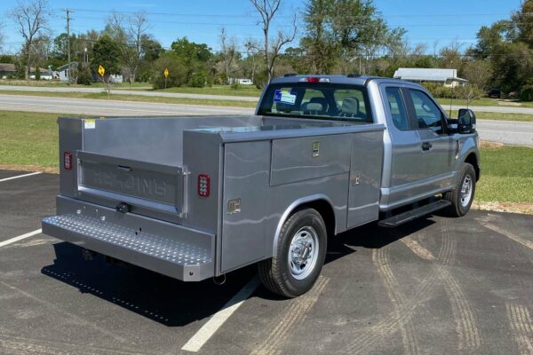 Silver truck with tool compartments