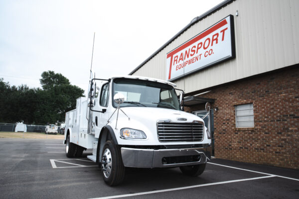 A closeup of a white truck in front of the Transport Equipment Company location